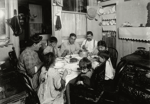 An Italian family has supper, East Side, New York City, 1915