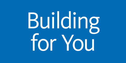 Graphic with blue background and white text that reads: Building for You.
